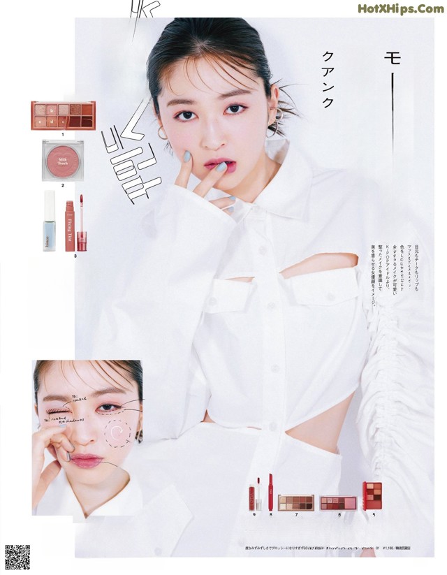 A woman in a white shirt is posing for a magazine.